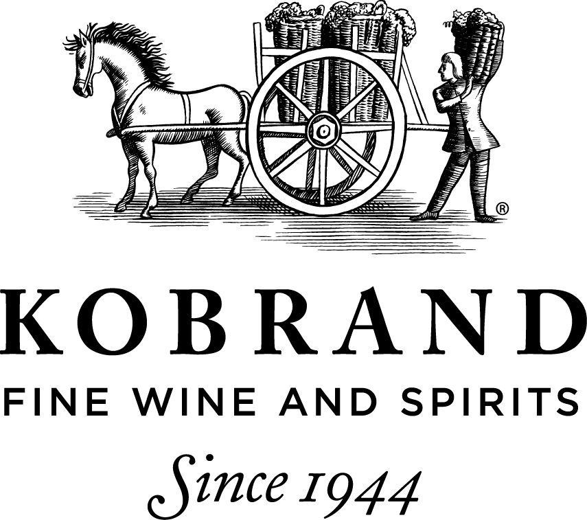 Illustration of a horse pulling a cart filled with barrels, led by a person. Text reads: "Kobrand Fine Wine and Spirits Since 1944. Illustration of a horse pulling a cart filled with barrels, led by a person. Text reads: "Kobrand Fine Wine and Spirits Since 1944.